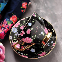Thumbnail for ​Tasse en porcelaine fleurie sur fond noir  |  Théières à la folie